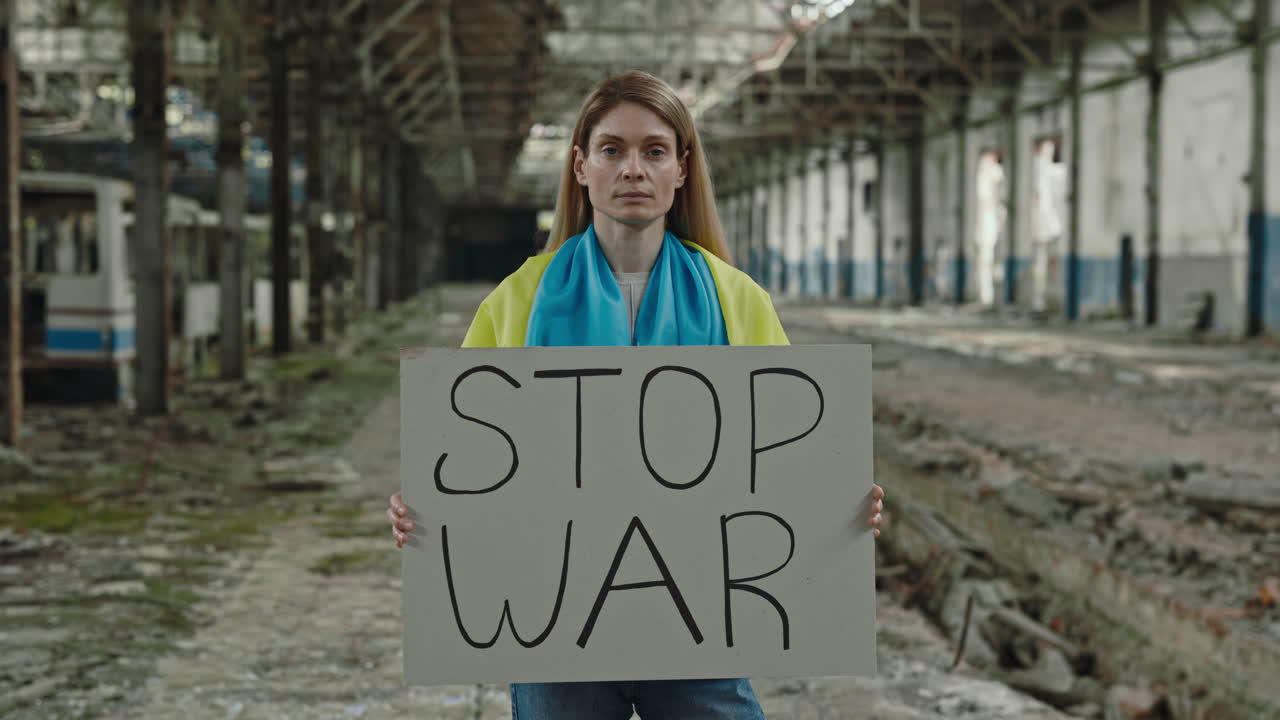 Woman Protesting War in an Abandoned Factory