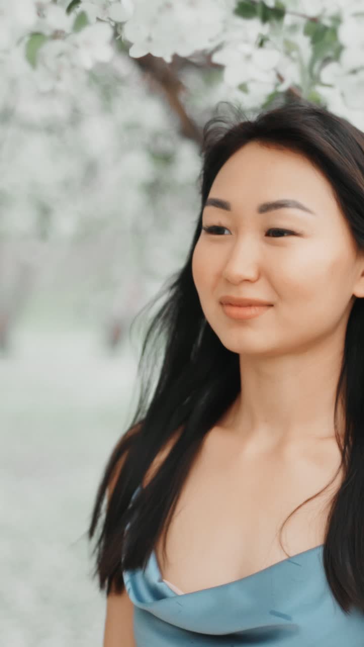 Asian Woman in Springtime Flowers