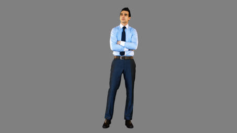 businessman standing with arms crossed