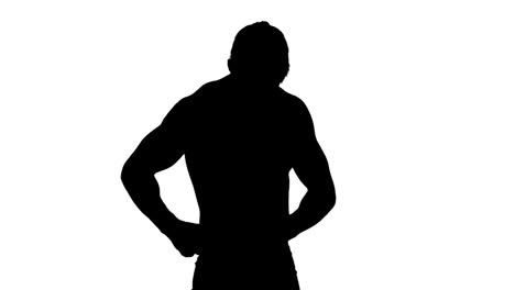 muscular silhouette of man measuring his waist