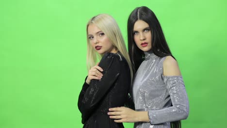 two women in fashion dresses
