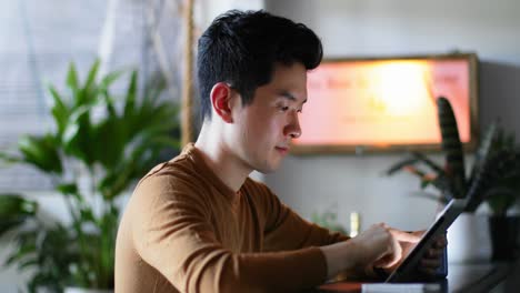 man using digital tablet on kitchen counter 4k