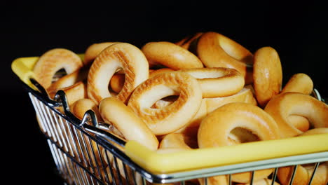 small bagels in a shopping trolley in miniature 4k video