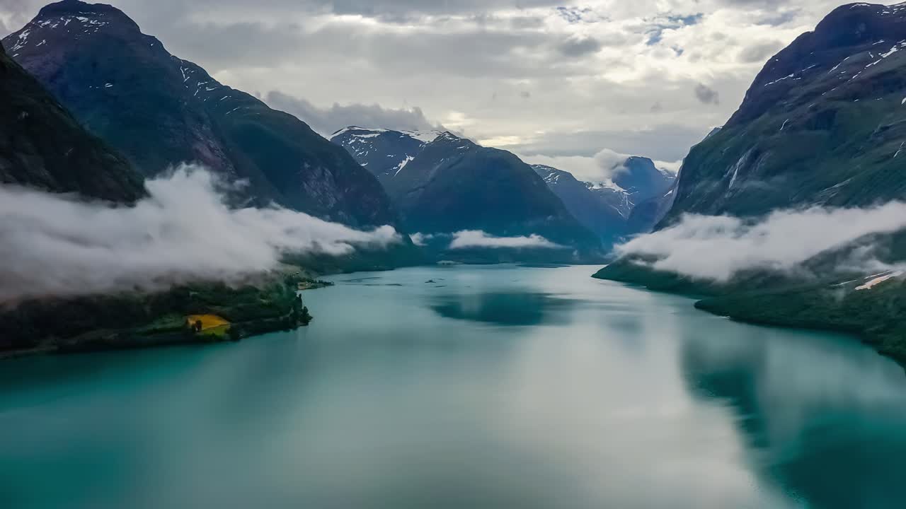 Beautiful Nature Norway natural landscape lovatnet lake flying over the clouds.