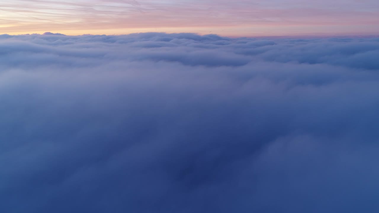 Drone flight above moving cloudscape