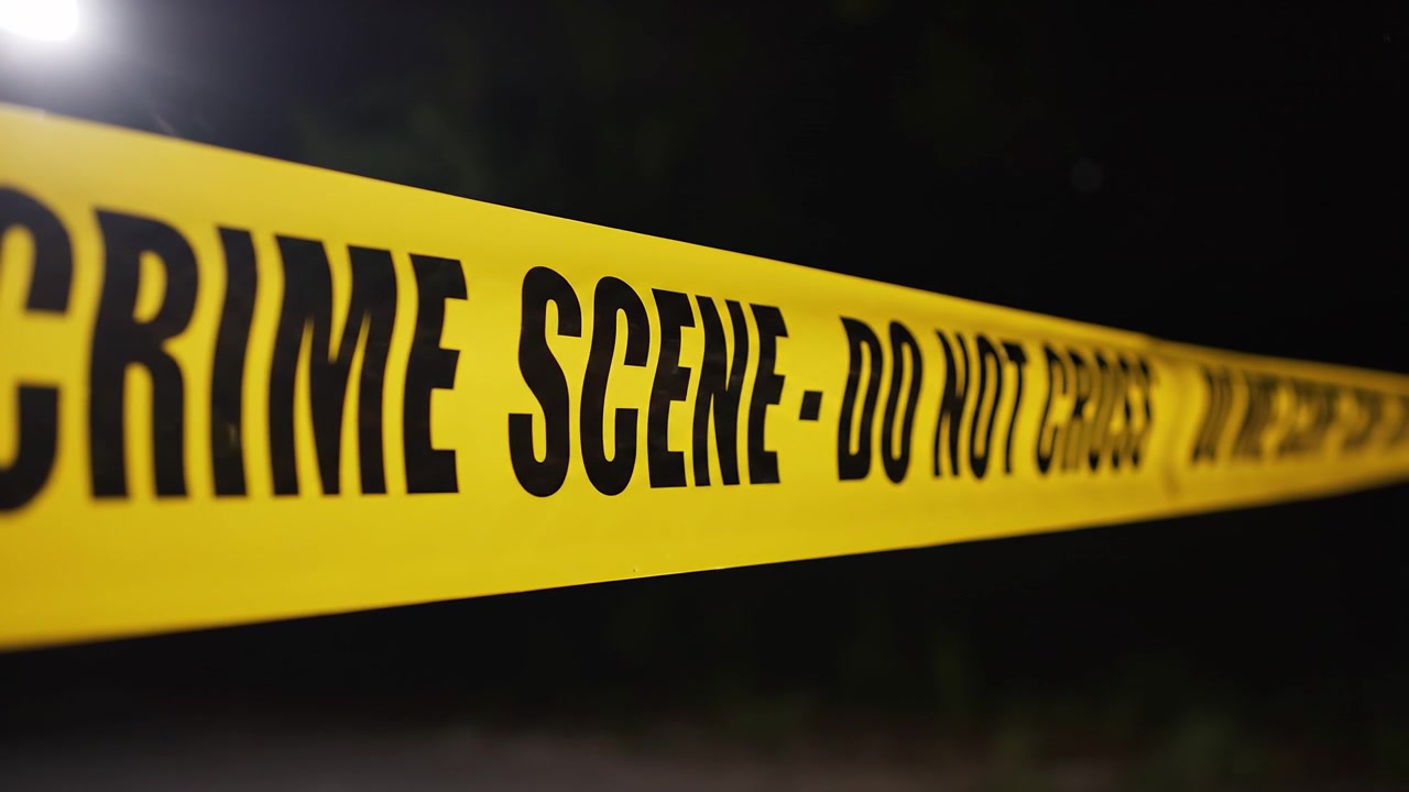 Yellow crime scene do not cross tape at night