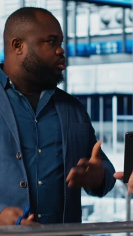 vertical video manager oversees work done by engineering team in industry 4.0 industrial plant