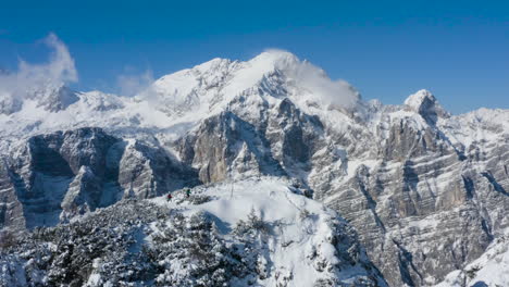 snowy alpine peaks with hikers