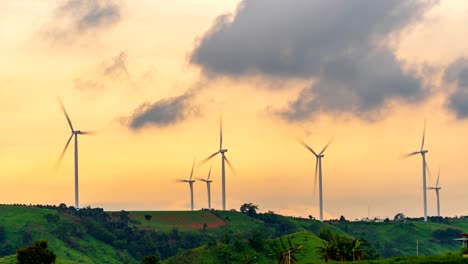 time lapse at sunset of a wind turbine on mountains in thailand