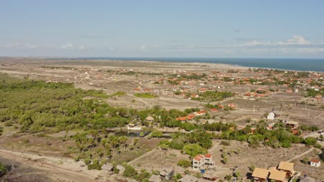 Flight-above-arid-rural-Macapa-village-on-Brazilian-coastline-in-daylight