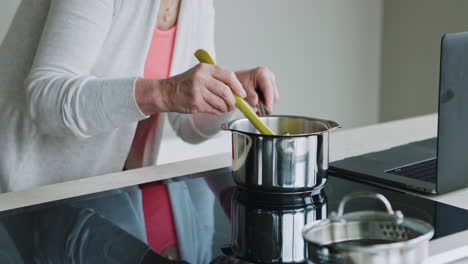 woman cooking in kitchen