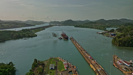 panama city aerial v30 cinematic drone flyover miraflores locks towards pedro miguel locks with cargo tanker ship transiting at the canal waterway - shot with mavic 3 cine - march 2022