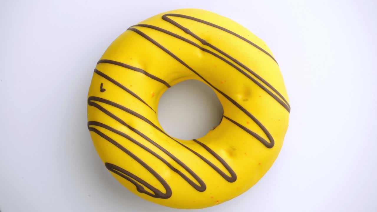 Doughnut glazed close-up. Seamless looping.