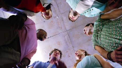 Group-of-business-executives-forming-hands-stack