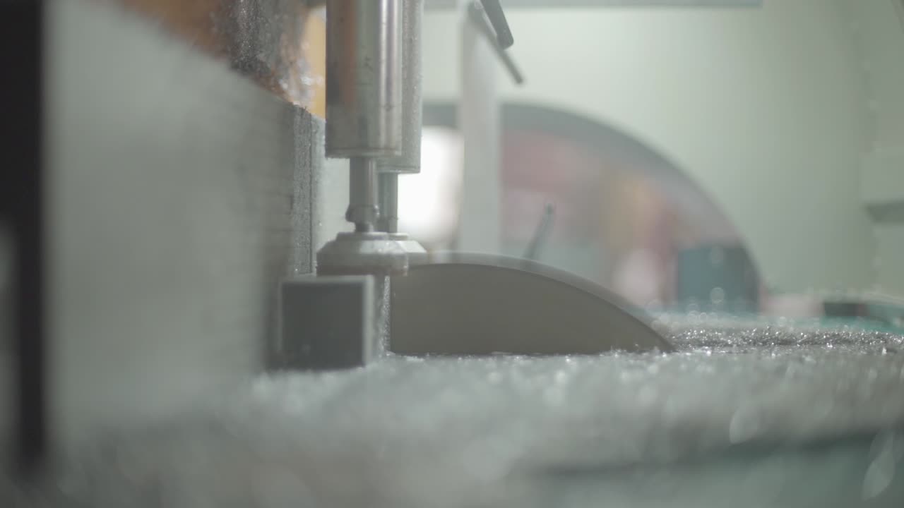 Close-up view of a glass cutting machine in operation