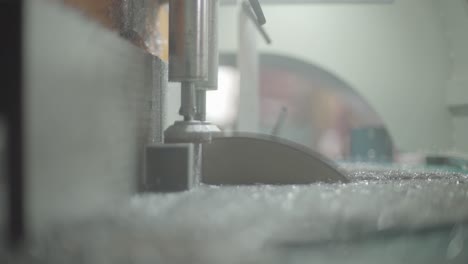 close-up view of a glass cutting machine in operation