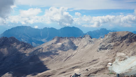 Rugged-grey-dry-valley-ridge-line-with-cloud-shadow,-Zugspitze,-Germany