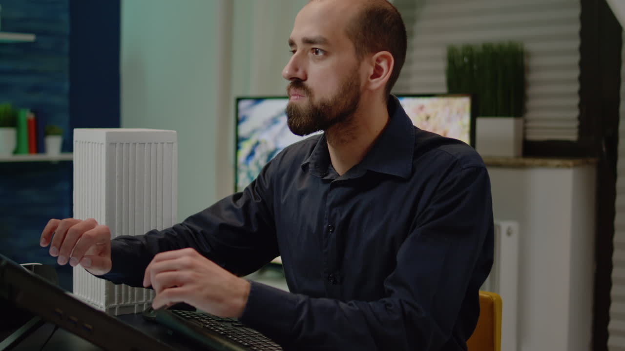 Man architect working on touch screen computer