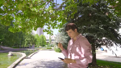 Man-rejoicing-and-winning-outdoors.