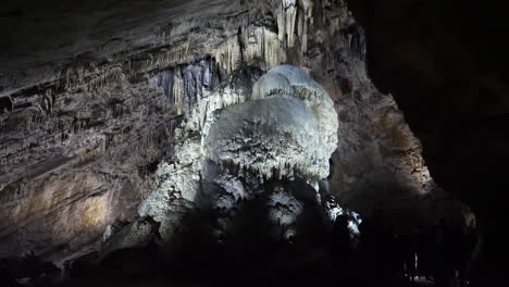 giant stalagmite in gallery in touristic cave