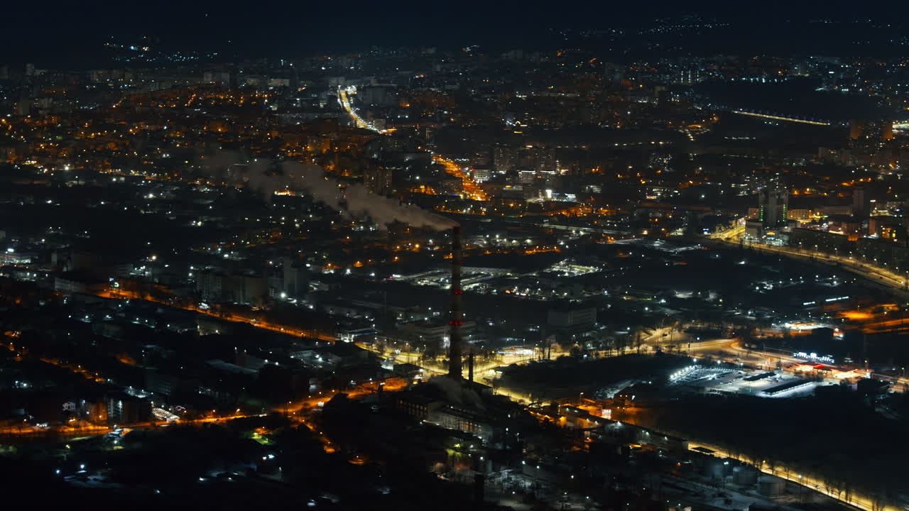 Aerial drone view of Chisinau city covered in snow at night, blue hour. Moldova
