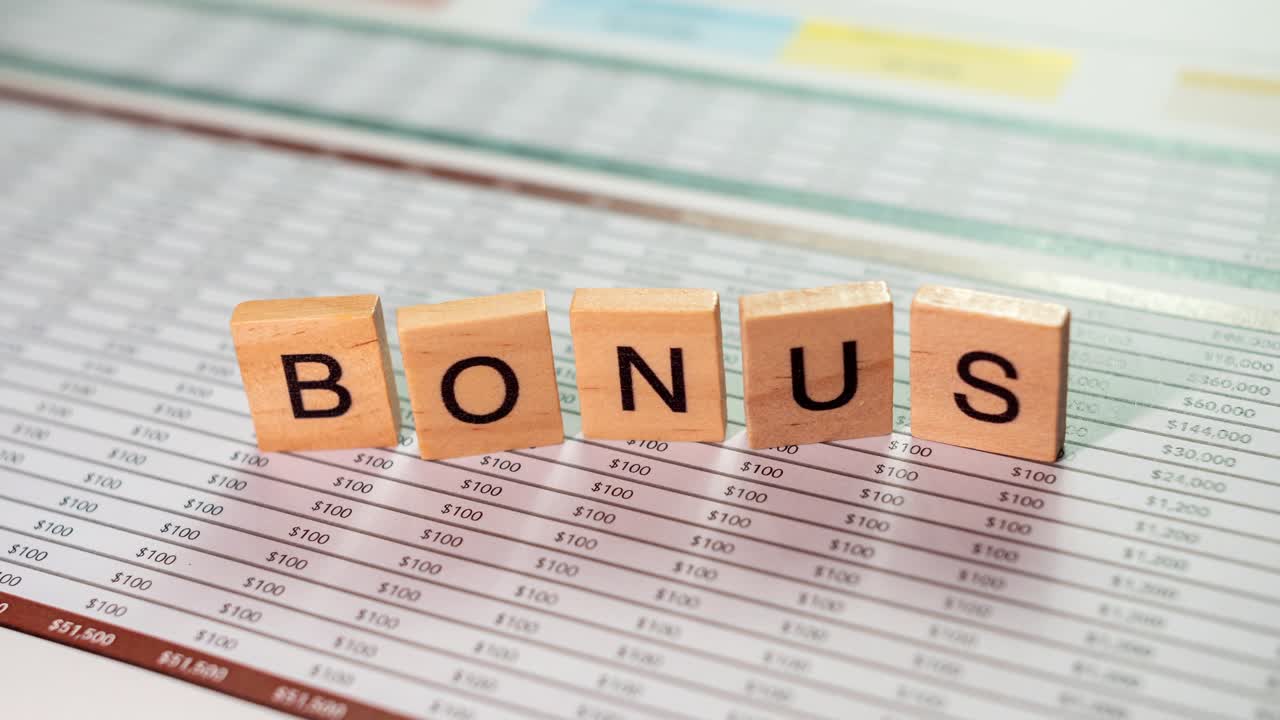 Explore key business metrics and bonus insights captured in a focused office setting.