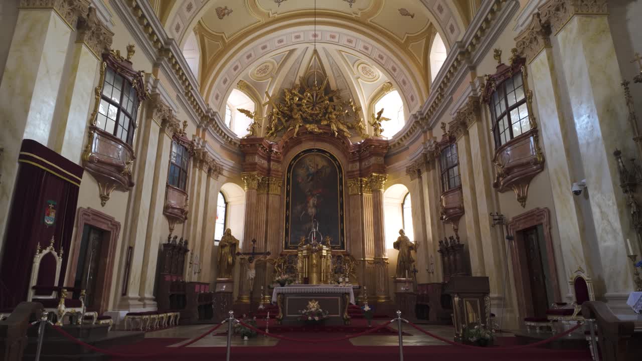 Golden altar inside Saint George’s Catholic Cathedral in Timisoara, highlighting intricate Baroque details and ornate decoration