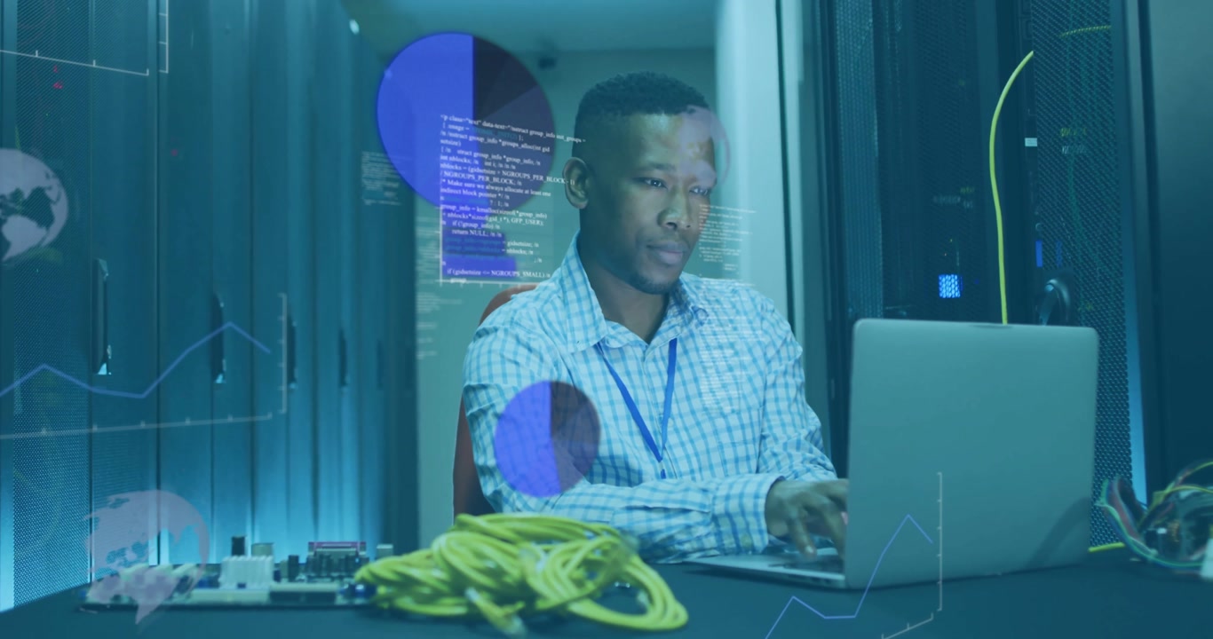 IT specialist powering laptop in server room and analysing live data visuals while tuning settings