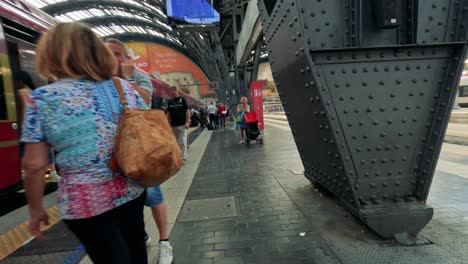 passengers boarding and alighting at milan train station