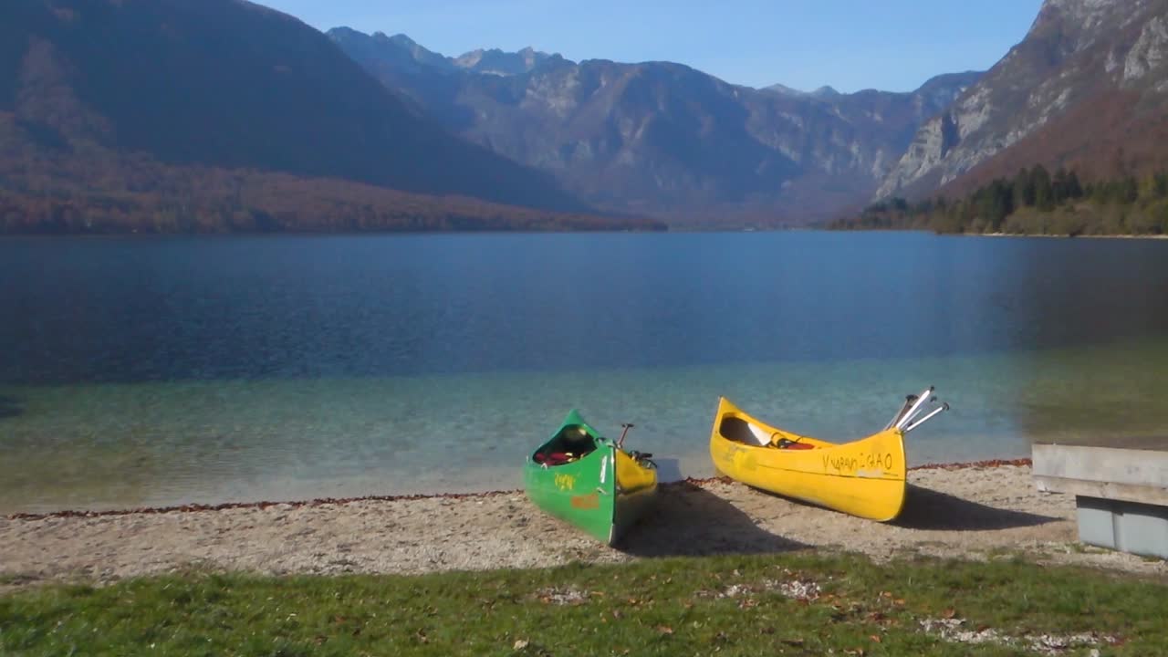 Colorful canoes,kayaks on the alpine lake Bohinj, Slovenia,Europe