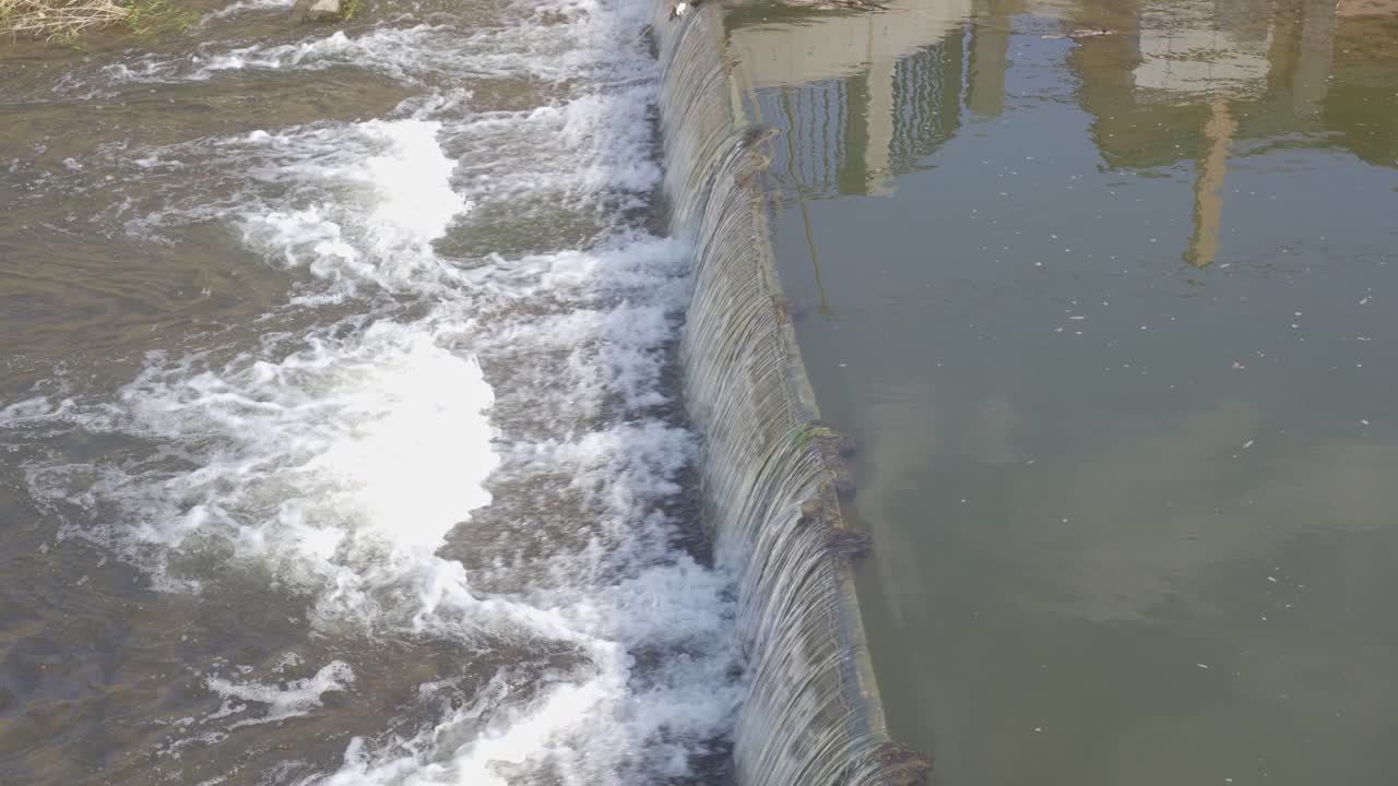 Flowing water in an urban district of the city