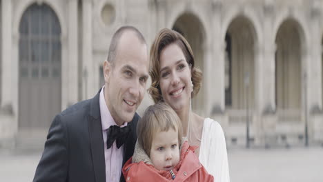 happy family portrait in paris