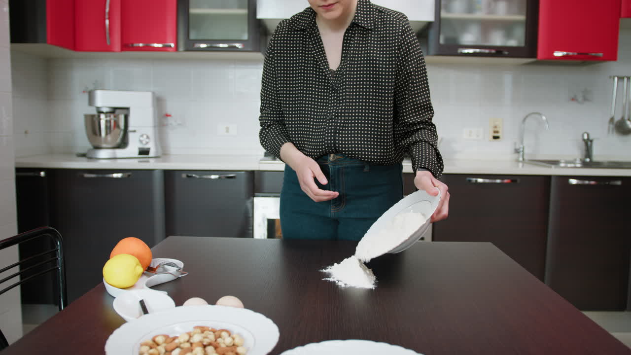 Woman Puts Flour On A Table For The Preparation Of A Typical Dessert