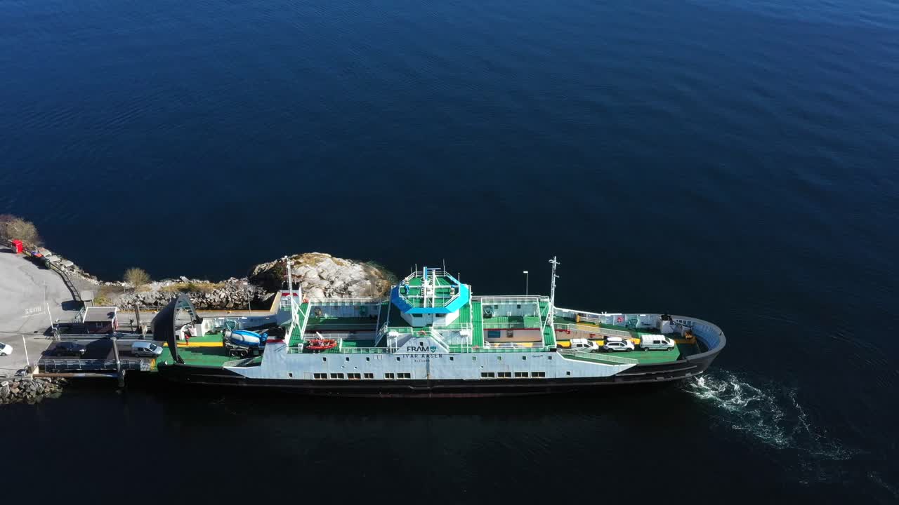 The car ferry MF "Ivar Aasen" loads cars going across the fjord