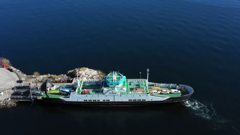 the car ferry mf "ivar aasen" loads cars going across the fjord