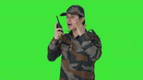 angry indian army man giving instructions on walkie talkie green screen