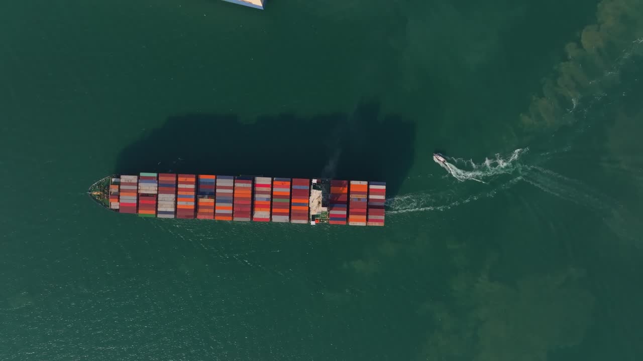 Container vessel navigating open waters for transport, Thailand