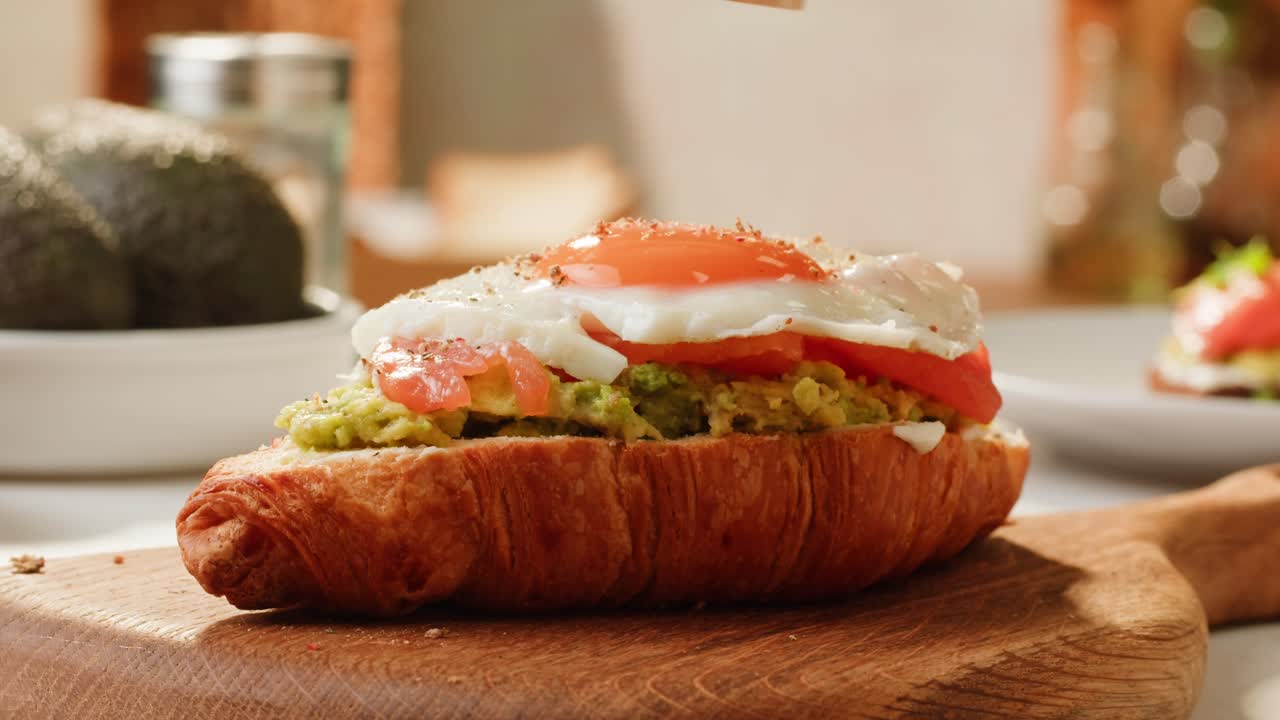 Avocado Toast Croissant Sandwich with Fried Egg