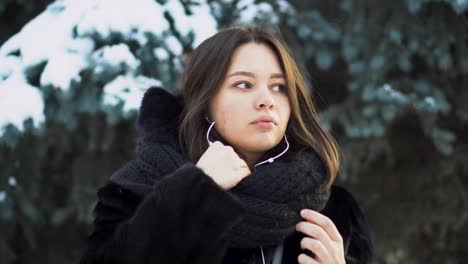 woman listening to music in winter