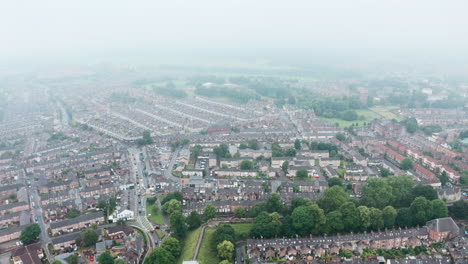 Drone-shot-over-York-suburbs-city-wall-in-the-rain