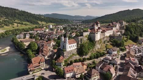 drone view of aarburg castle, aare river, and old town in solothurn, switzerland