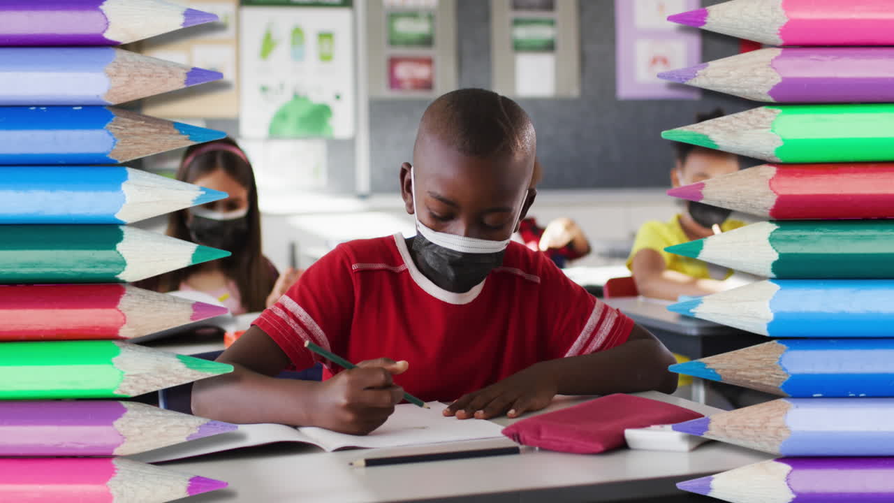 Animation of crayons over diverse schoolchildren wearing face masks