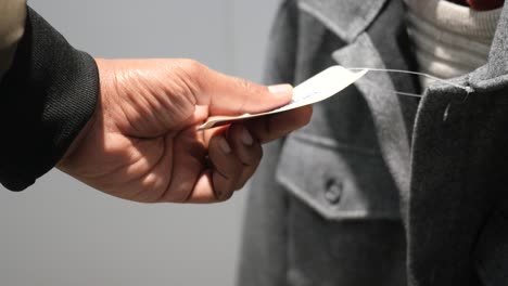 person holding a clothing tag