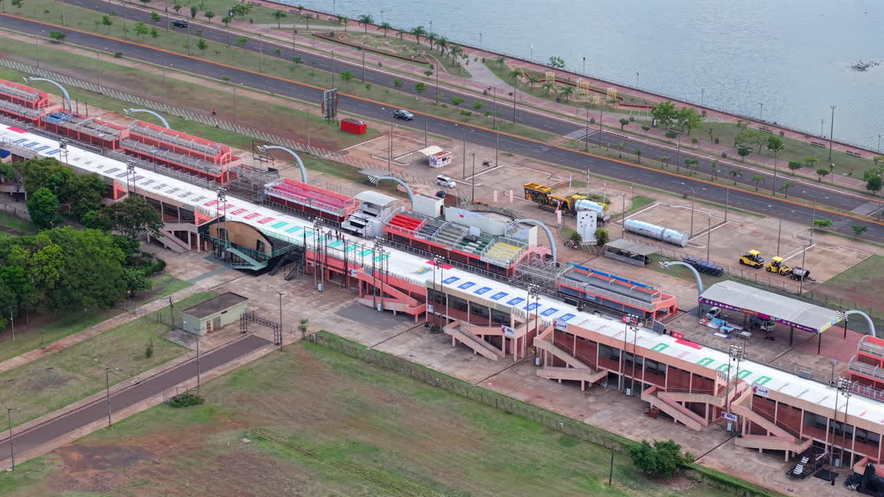 Aerial overview of Sambodromo parade grounds in Encarnación, Paraguay with track and road layout visible