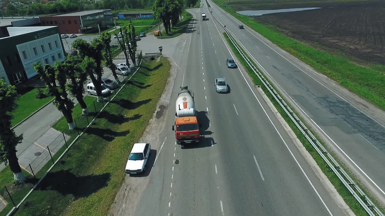 Concrete Mixer Truck. Special concrete transport truck in transit mixer unit on country road