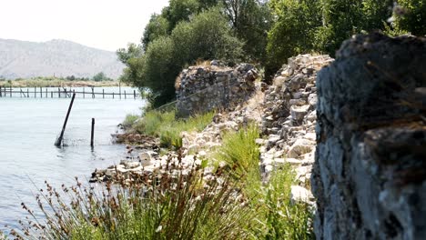 butrint, albania, view of the lake shore near ancient ruins