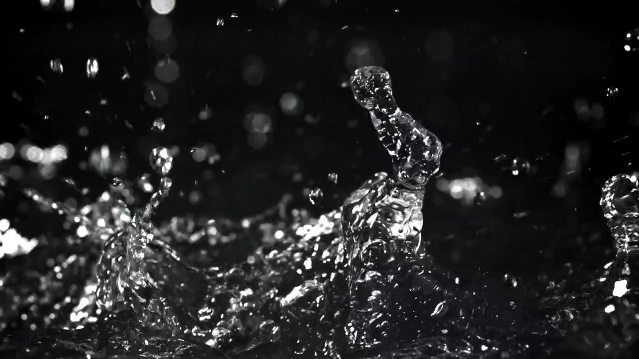 Slow Motion Water Droplets Splashing on Black Background