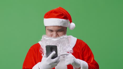 santa claus using a smartphone