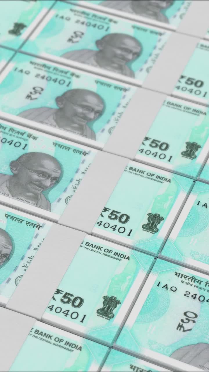 Vertical video of 50 RUPEES banknotes printing by a money press