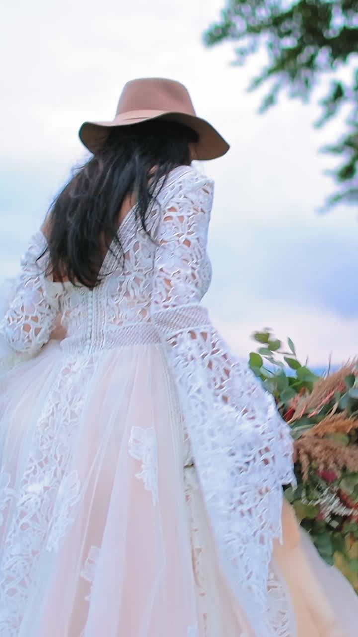 bride posing against mountain. Bride in elegant dress posing on background of mountains